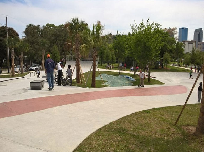 Perry Harvey Sr. Park with a skate park and sidewalks in the background.