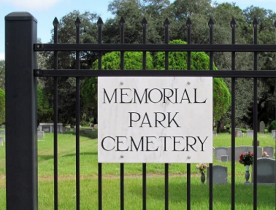 A sign that reads Memorial Park Cemetery.