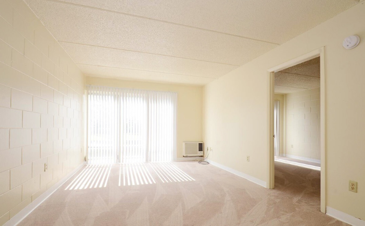 A brightly lit living room with sliding doors.