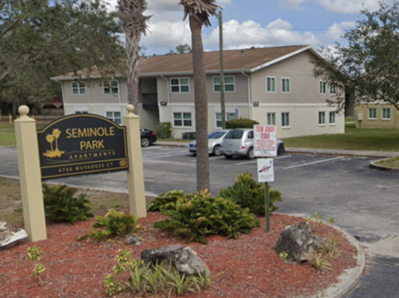 Apartment complex with a sign that reads Seminole Park Apartments.