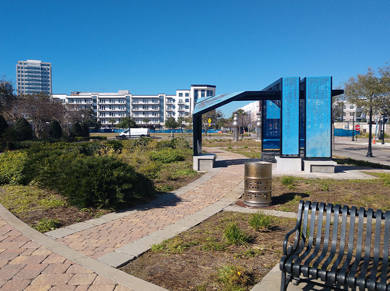 Technology park with view of the city and park benches in the background.