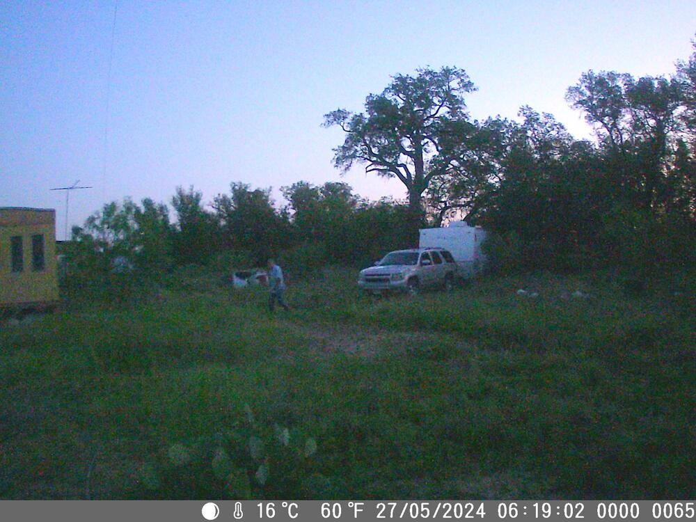 Suspect next to a camper trailer.