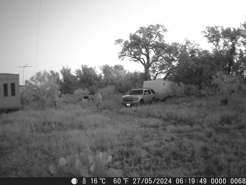 Suspect next to a camper trailer.