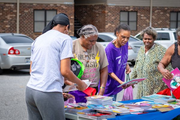 Volunteers setting out books for the giveaway. 