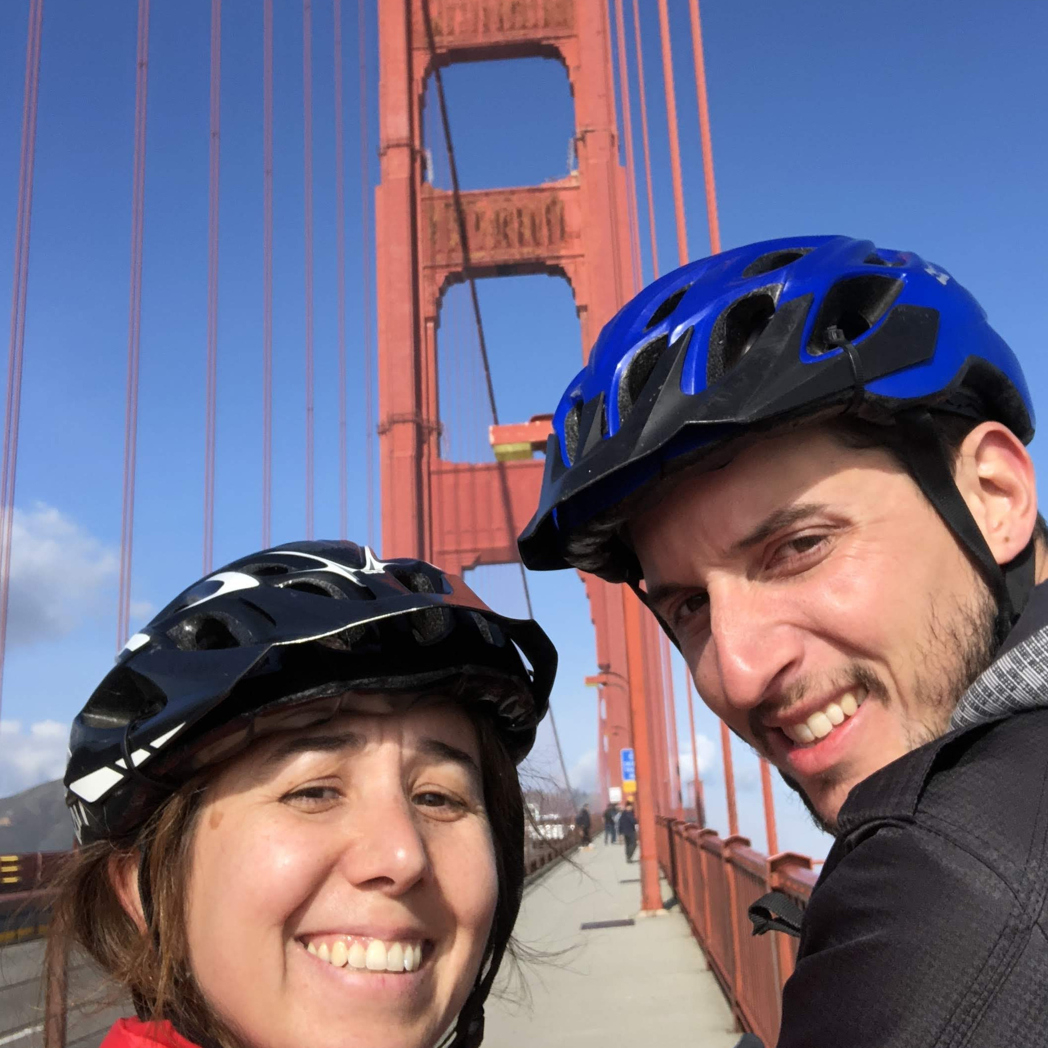 Cycling through the Golden Gate (Gino is a great biker, and Flor does her best to follow him)