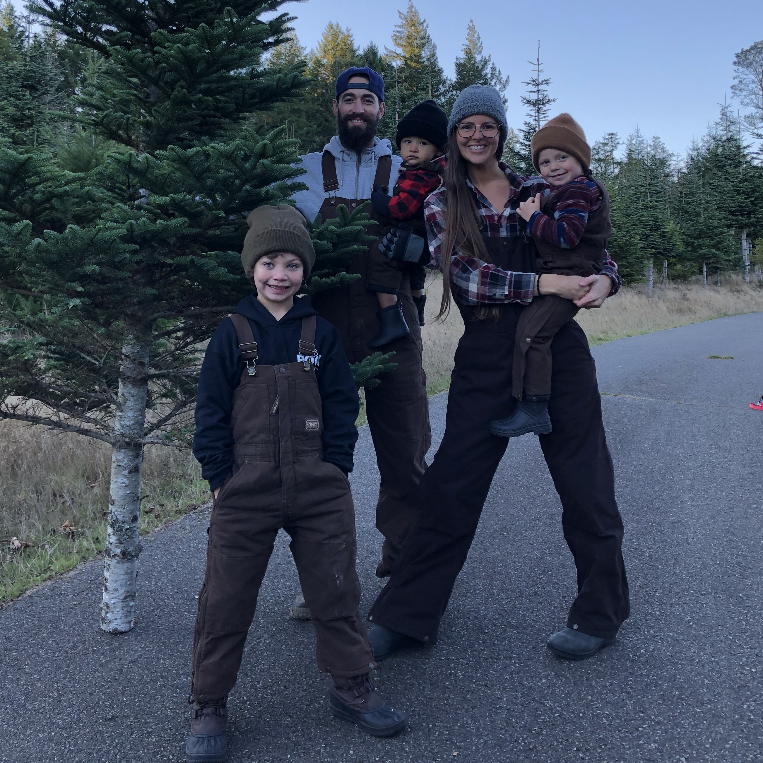 Annual Christmas tree hunting tradition in our matching overalls