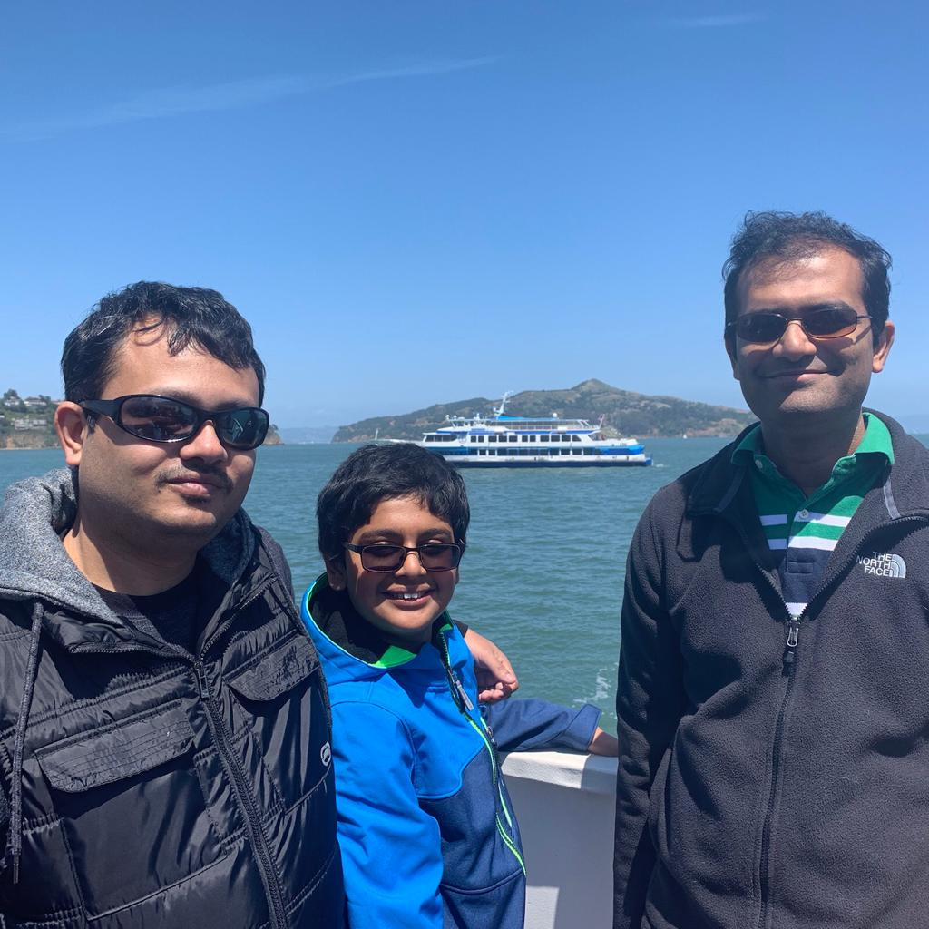 Tirtha on a boat ride with friend & his son