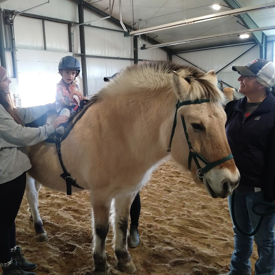 Allie does different therapies for developmental delays. Hippotherapy is a favorite.