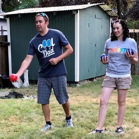 Enjoying the summer sun and playing lawn games.