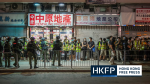 Hong Kong police search and fine protesters and journalists as dozens mark a year since Yuen Long mob attack