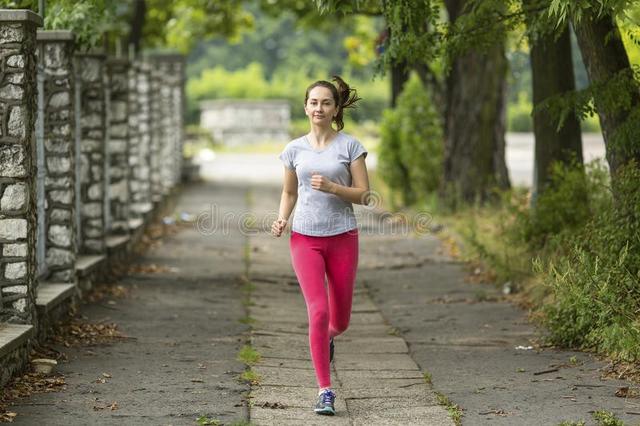 young-woman-jogging-park-morning-jog-healthy-lifestyle-running-59431795.jpg