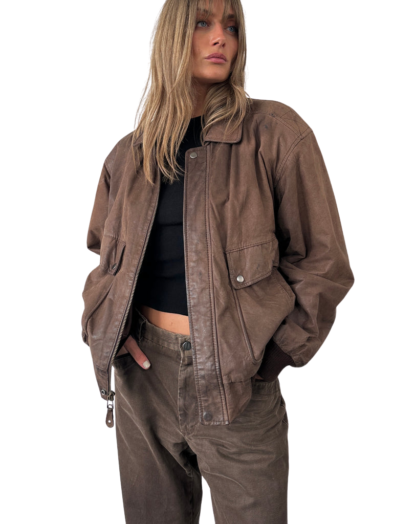 https://storage.googleapis.com/download/storage/v1/b/whering.appspot.com/o/marketplace_product_images%2Fwear-me-out-vintage-leather-bomber-jacket-brown-sdpY5uuo9cqQ74Th6S945i.png?generation=1713841678262657&alt=media