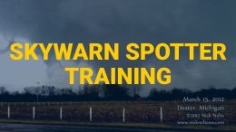 Skywarn Spotter Training image of open field with tornado-like cloud in the distance