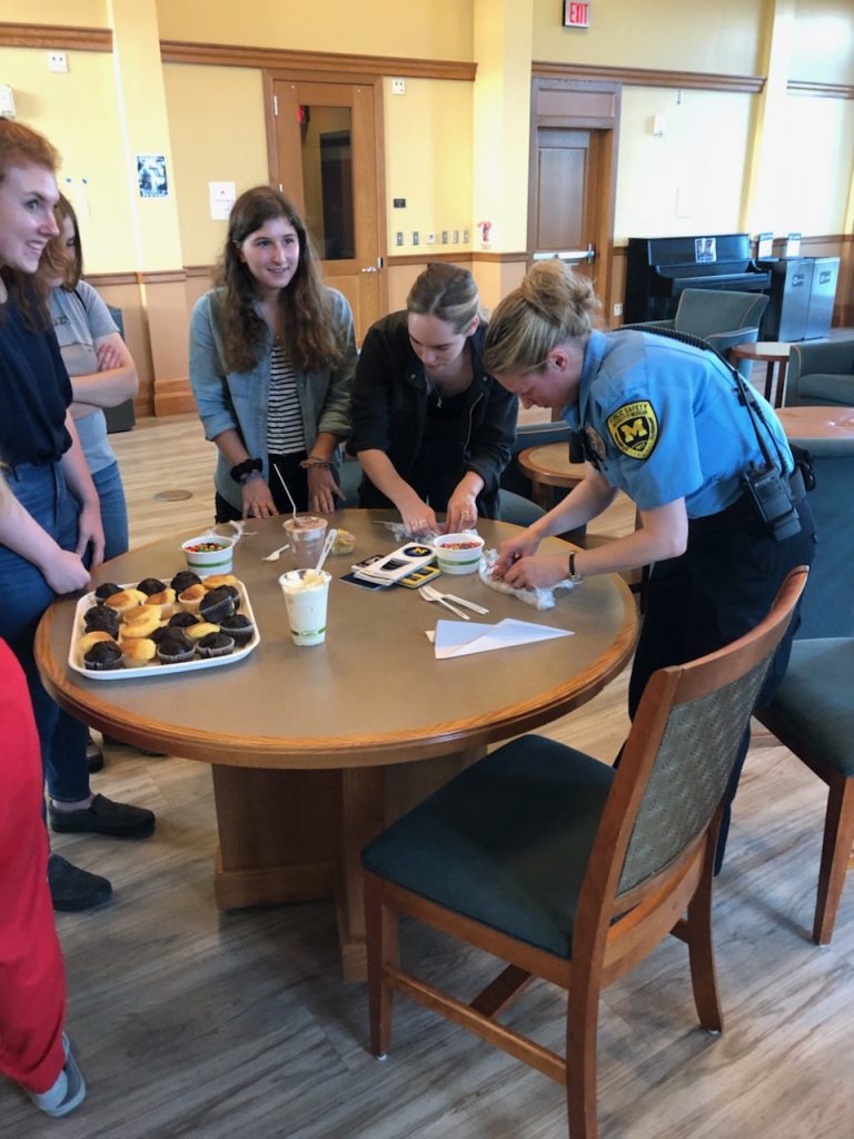 Housing Security Officer talking to students in North Quad on May 9, 2019.