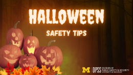 Image of four jack-o-lanterns sitting in orange and yellow leaves. Text reads: Halloween Safety Tips Logo: University of Michigan Division of Public Safety and Security
