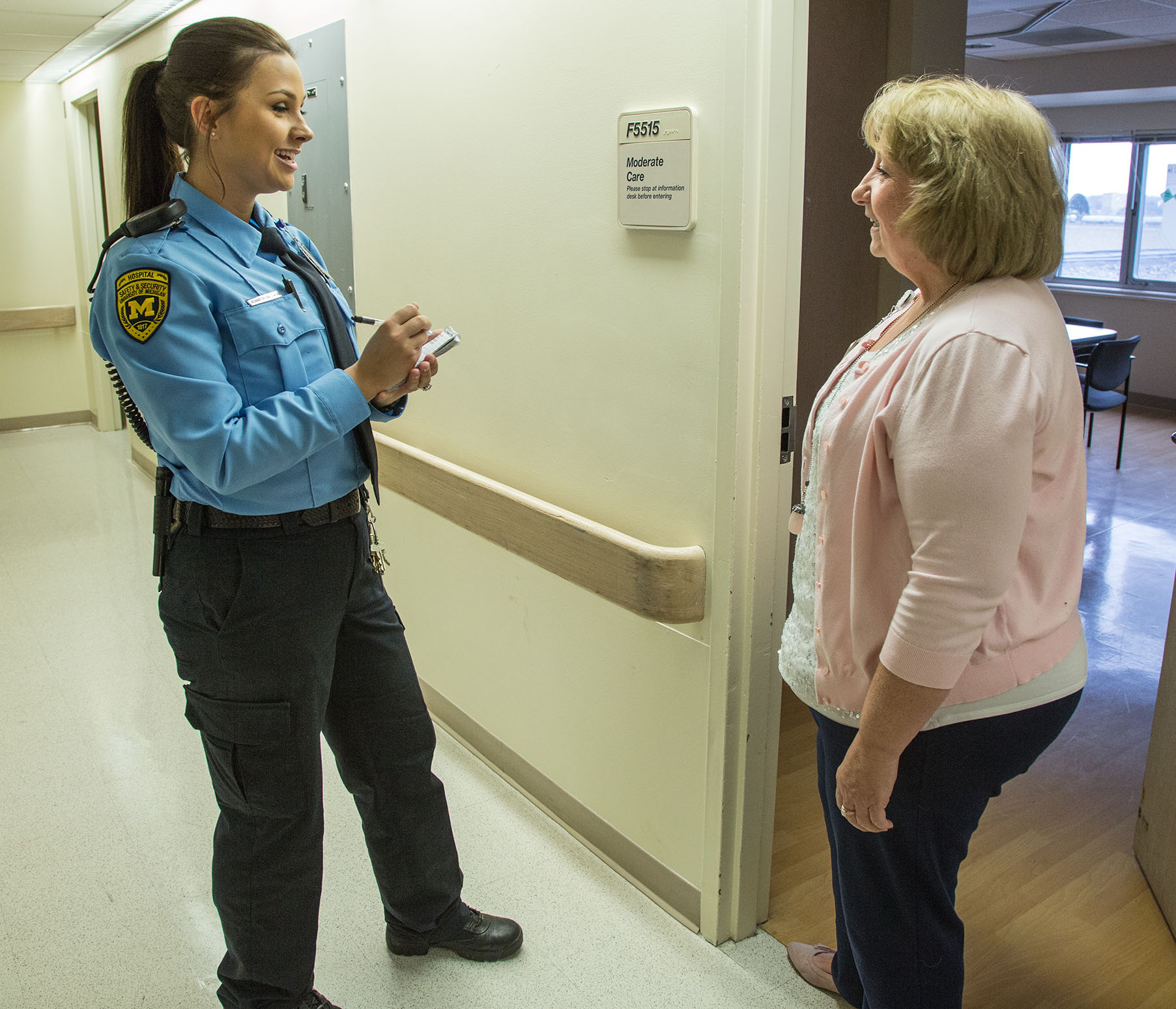 Security Officer Baldwin talks with a staff member.