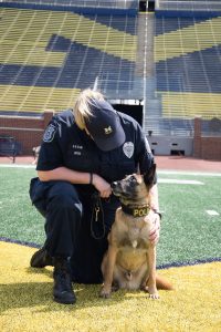 K-9 Nike and handler Officer Susan Upton on the field at Michigan Stadium