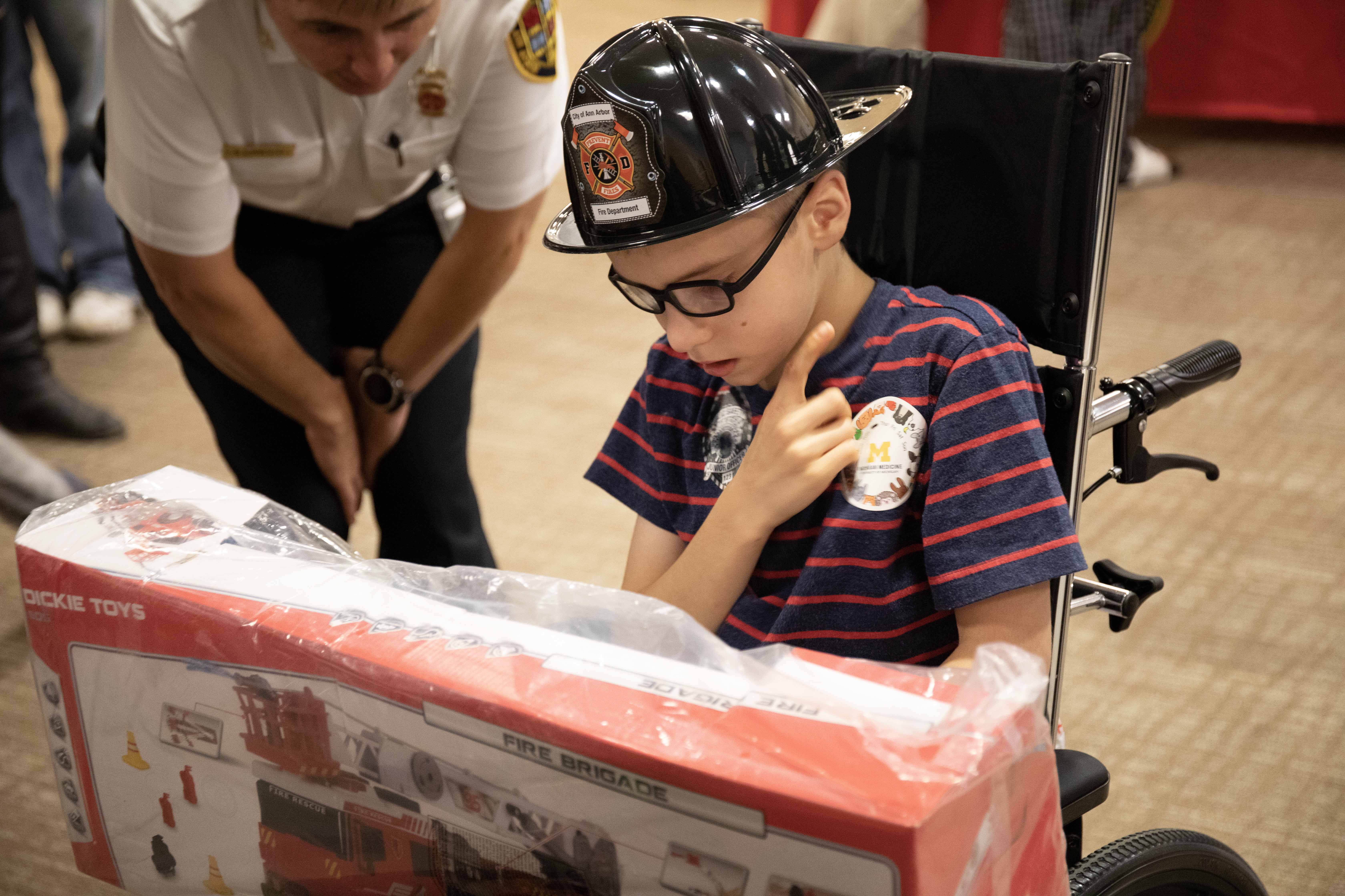 Aiden receives his firetruck prize