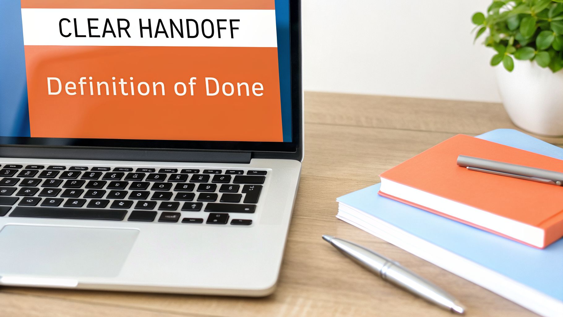 Laptop screen displaying 'CLEAR HANDOFF' and 'Definition of Done' with notebooks and pens on a wooden desk.
