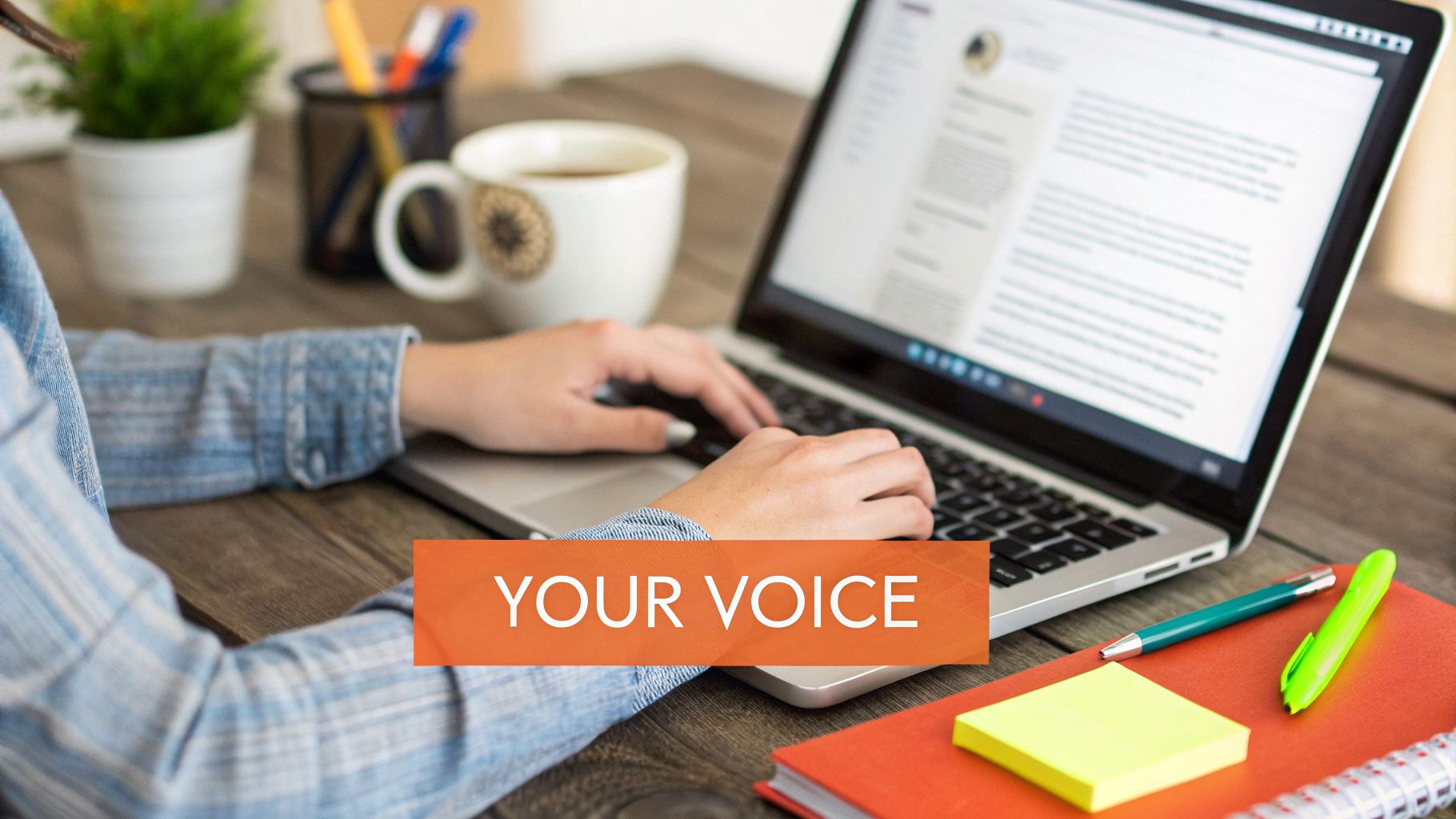 Person typing on a laptop with stationery, coffee, and plant on a wooden desk. Banner says YOUR VOICE.