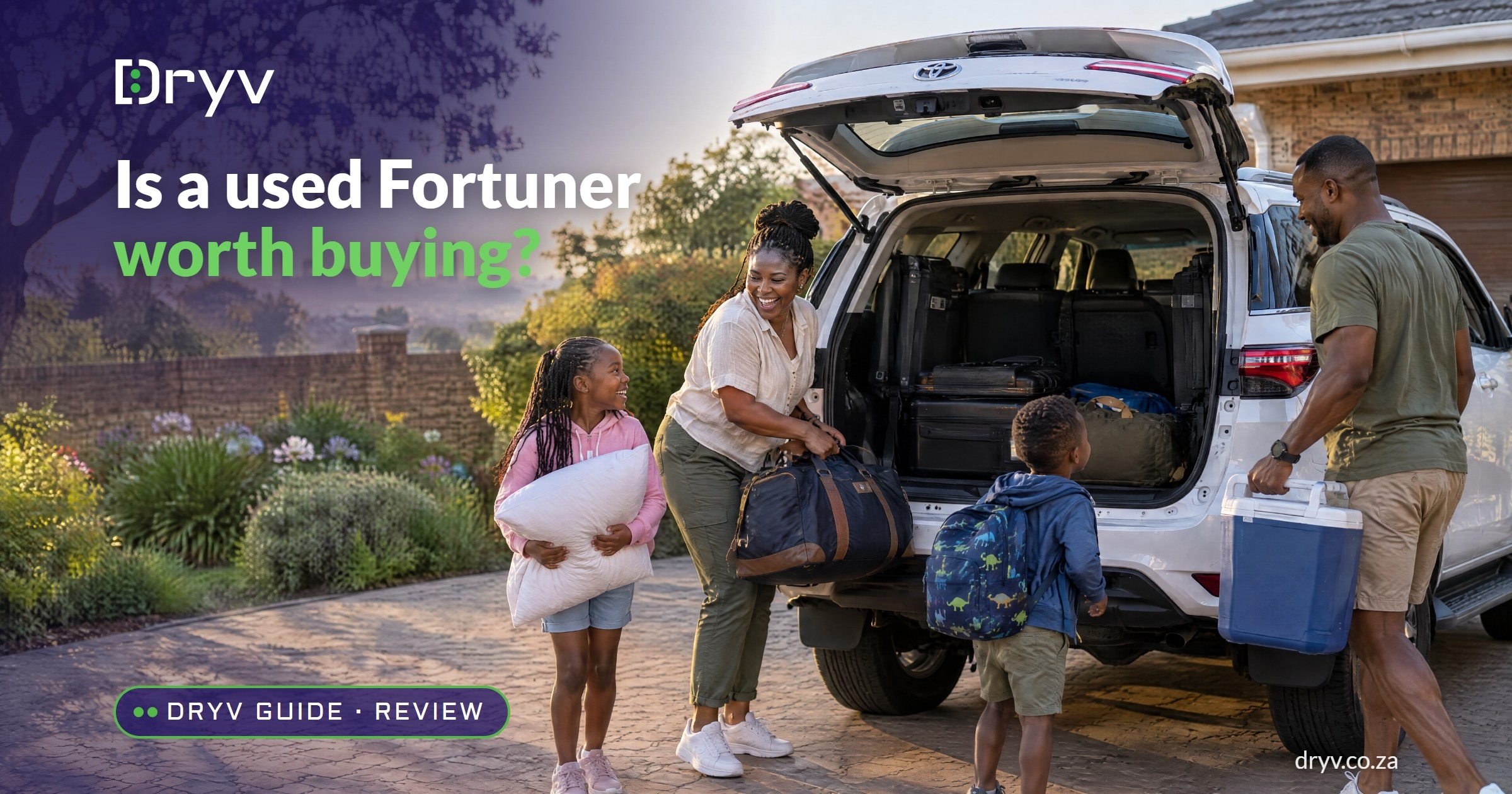 A family loads holiday bags into the open boot of a white Toyota Fortuner in a Johannesburg driveway at sunrise