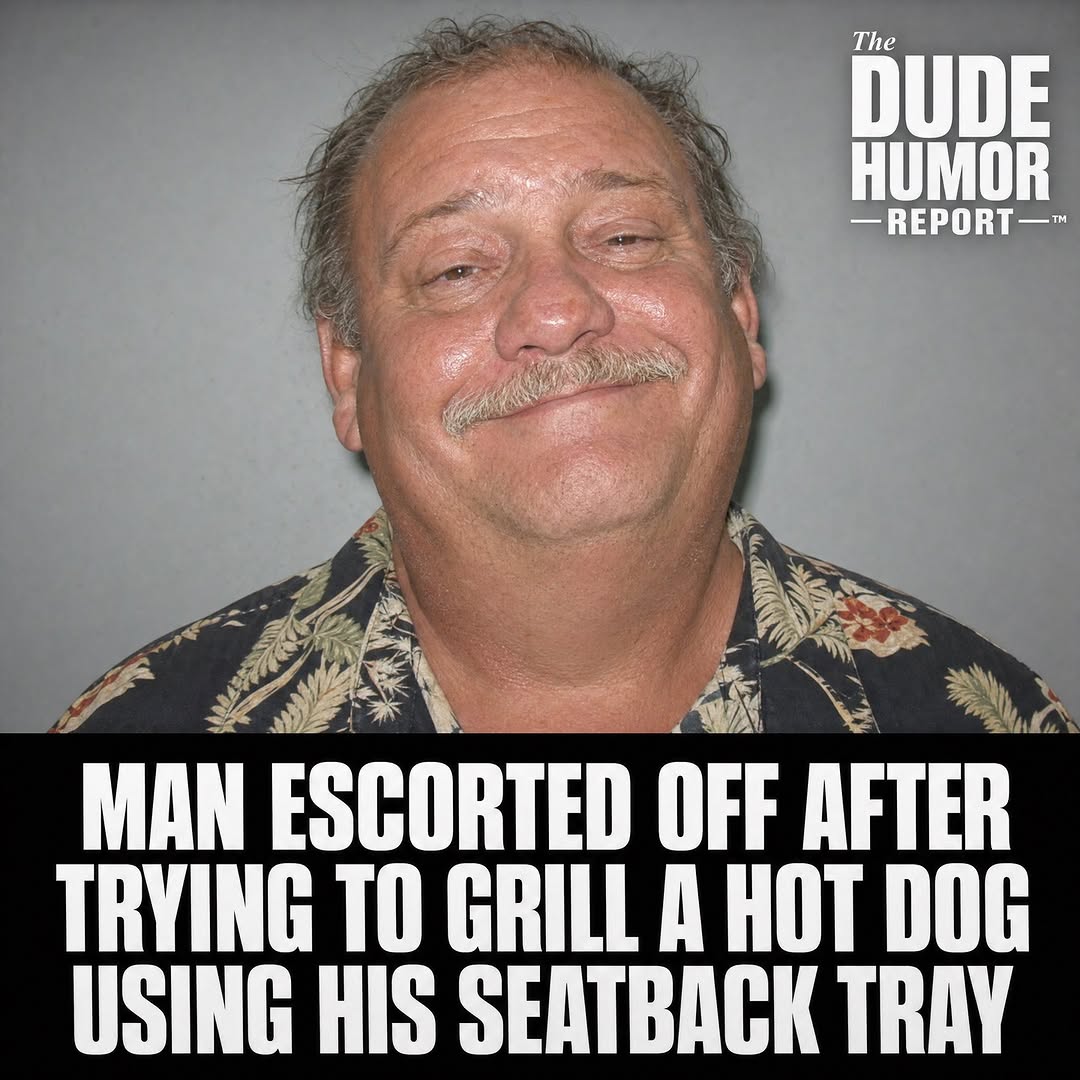 MAN ESCORTED OFF AFTER TRYING TO GRILL A HOT DOG USING HIS SEATBACK TRAY
