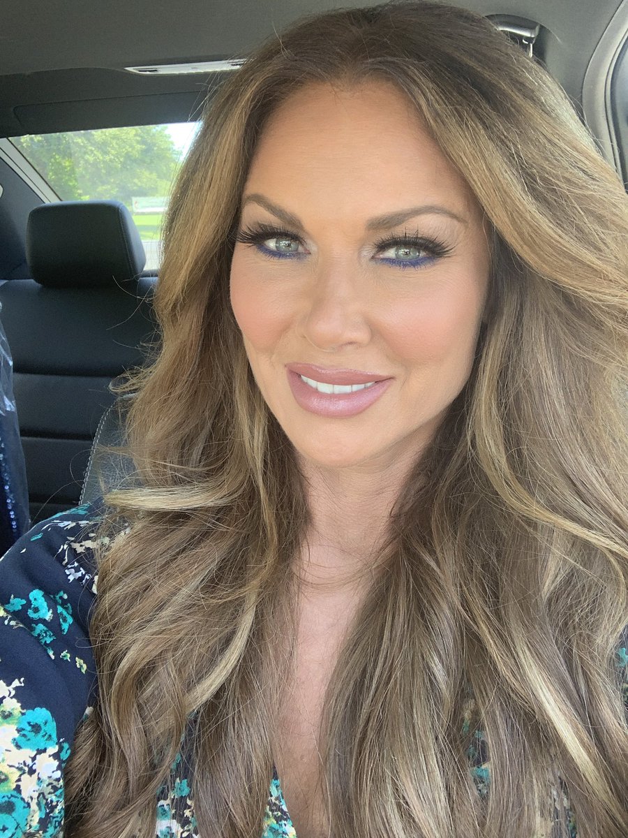 LeeAnne Locken smiles with long waves.