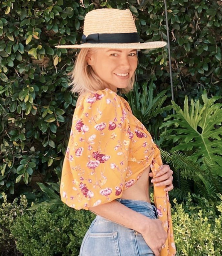 Ariana Madix wears a yellow floral shirt.