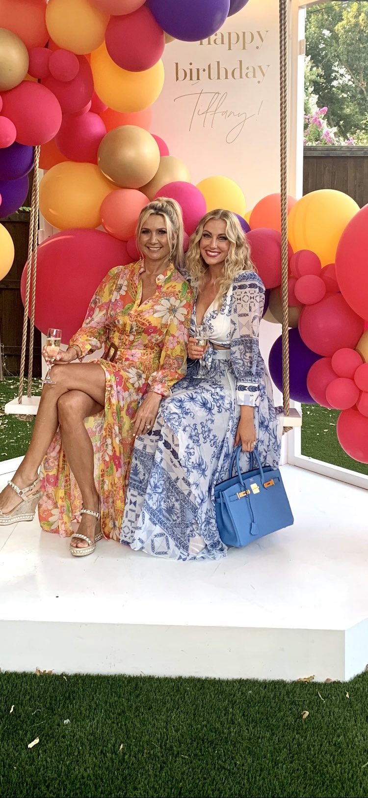 Kary Brittingham and Stephanie Hollman wear long, printed dresses.