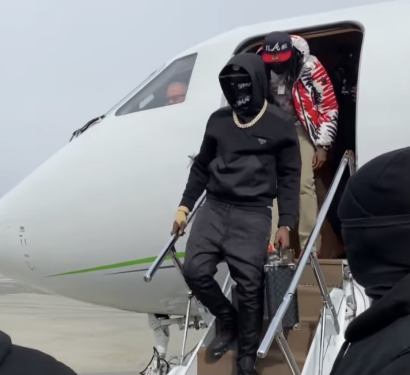 Quavo and Bobby getting off a private jet.
