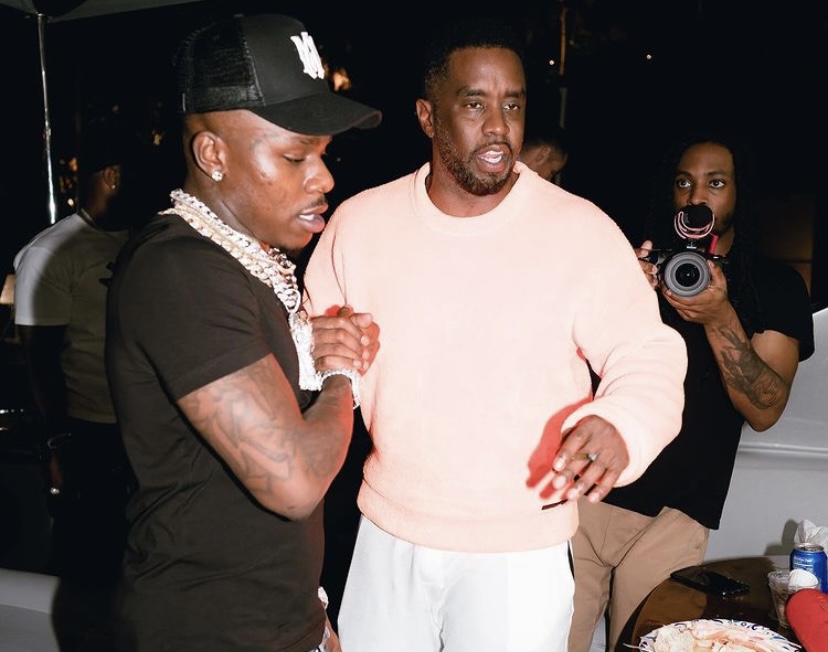 DaBaby shaking hands with Diddy.