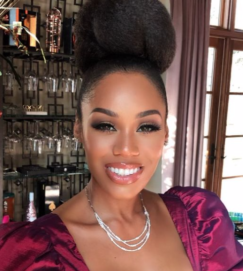 Monique Samuels wears her hair in a bun.