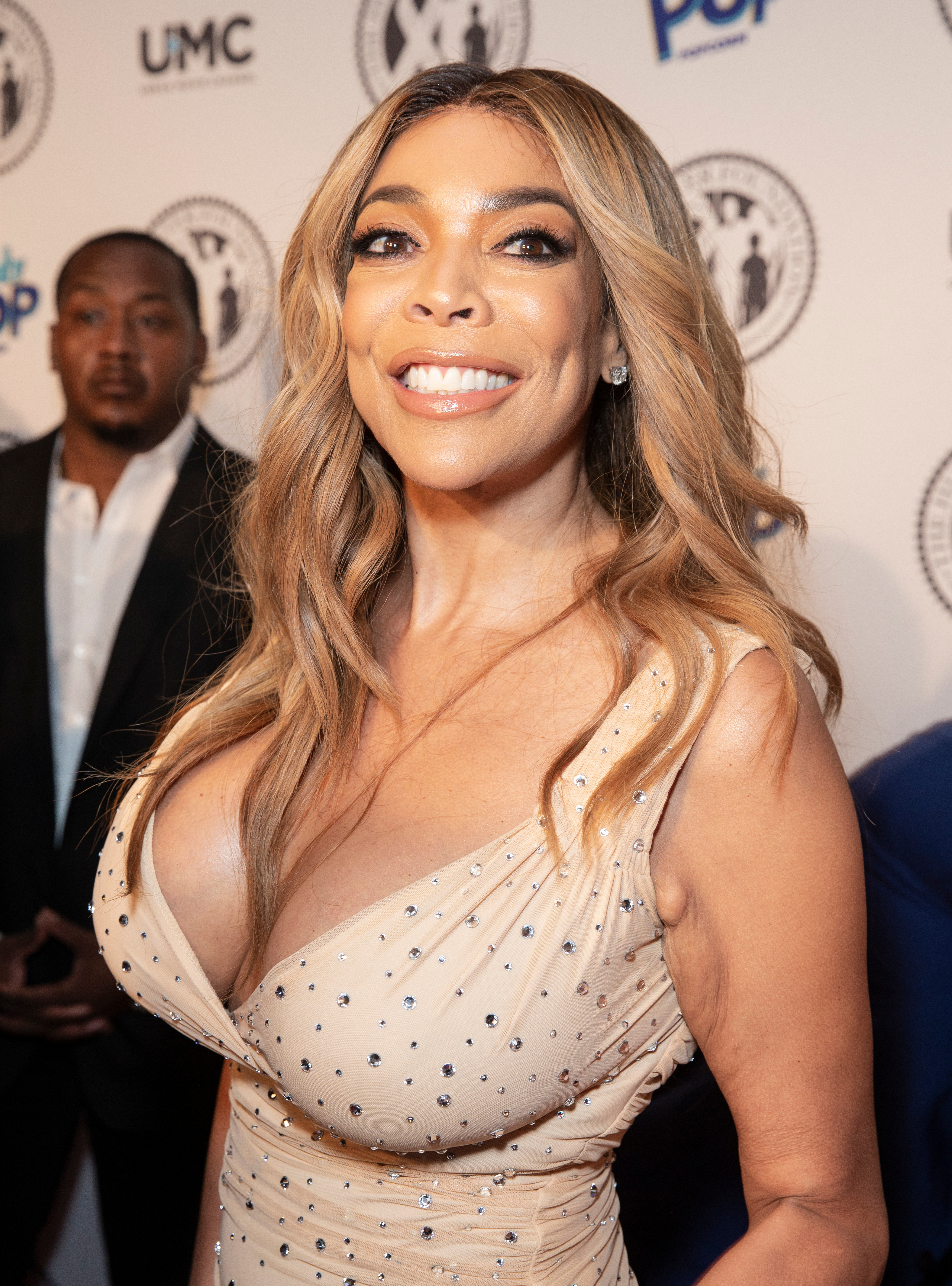 Wendy Williams looks insanely gorgeous in this brown dress designed with silver stones, that leaves nothing to imagination.