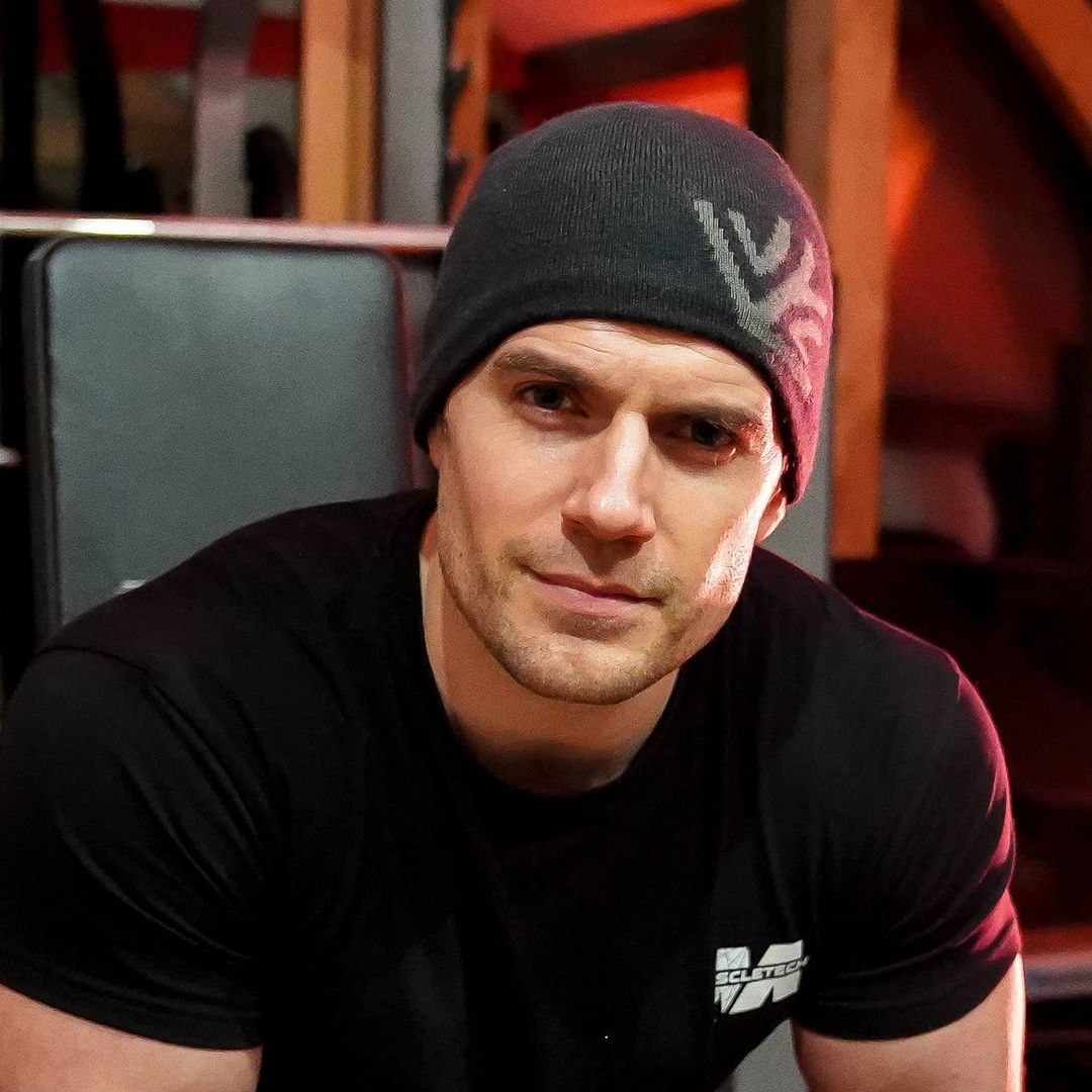 Henry Cavill looks breathtakingly incredible in this photo showing him in a black body-con shirt and beanie.