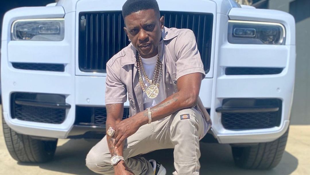 Boosie in front of his Rolls Royce.