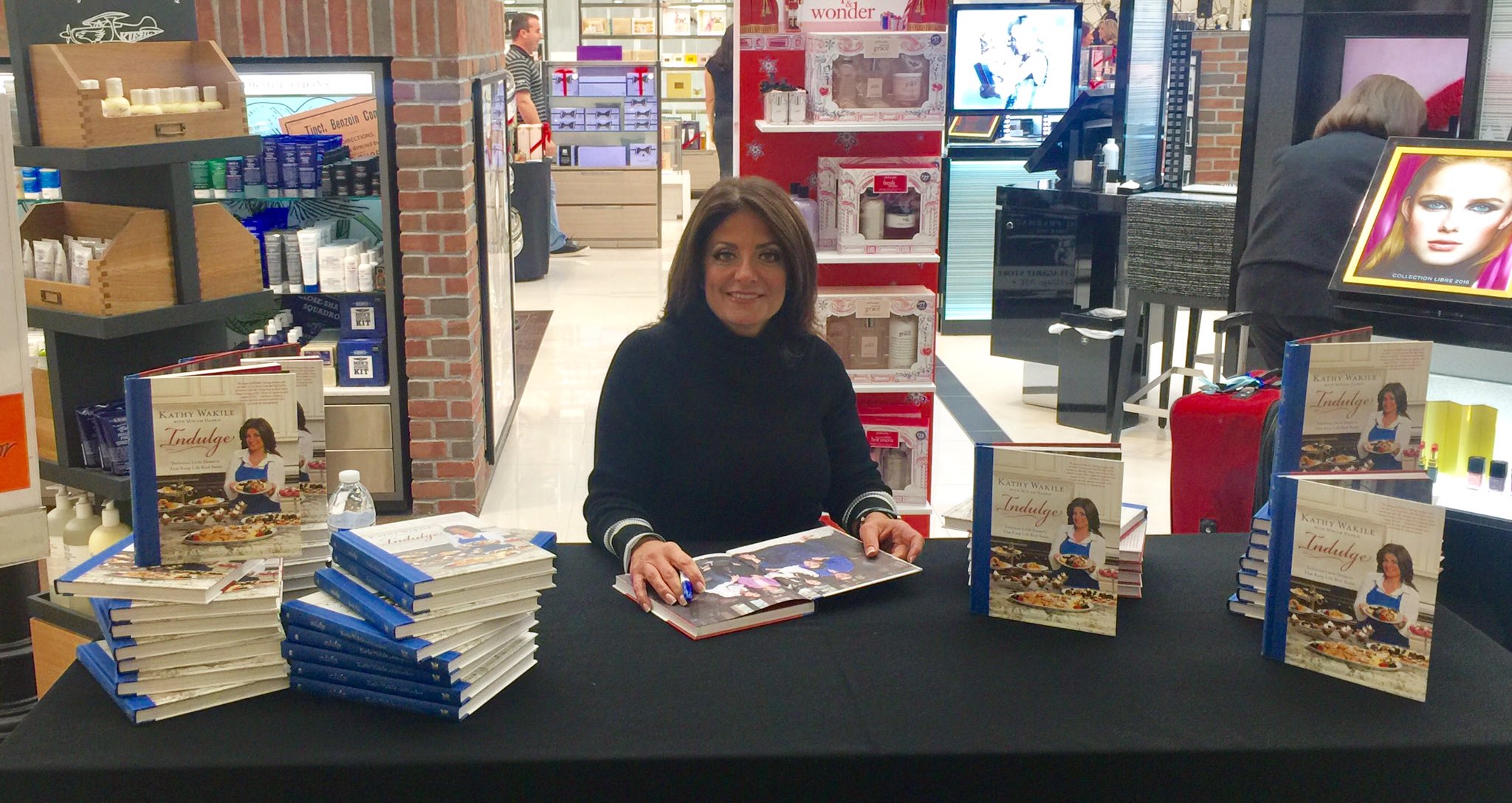 Kathy Wakile smiles at a book signing.
