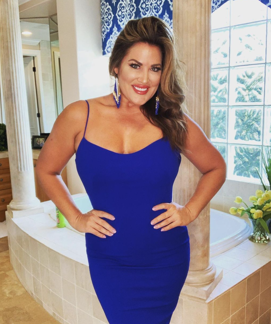 Emily Simpson wears a royal blue dress.