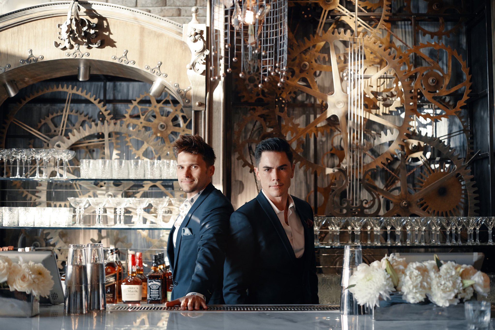 Tom Schwartz and Tom Sandoval pose behind the TomTom bar.