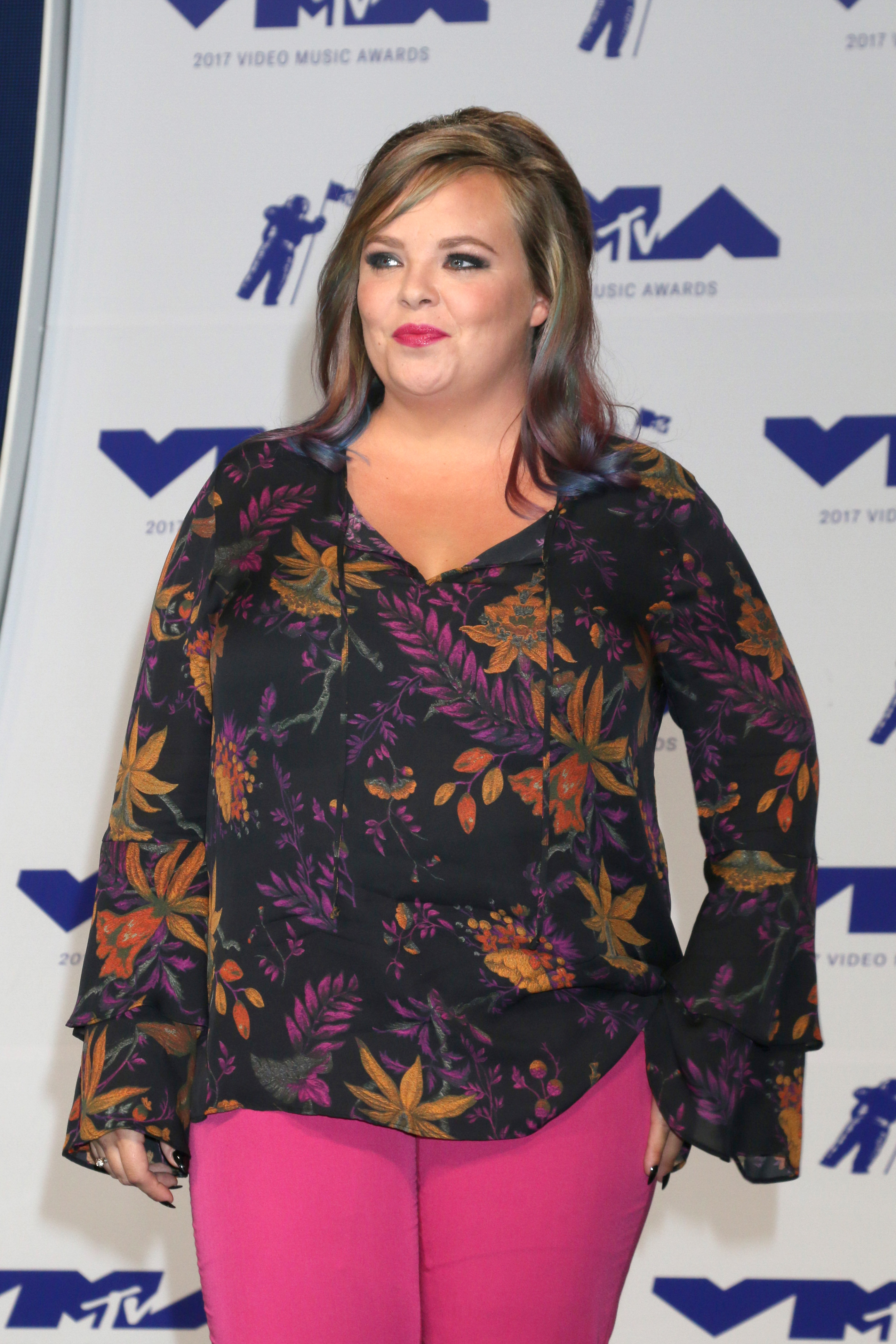 A photo showing Catelynn Lowell at the 2017 MTV Video Music Awards sporting a multicolored blouse and pink color blouse.