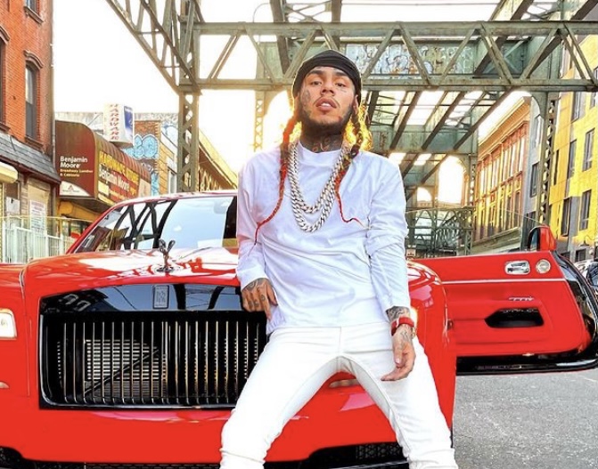 6ix9ine in front of his Rolls Royce.