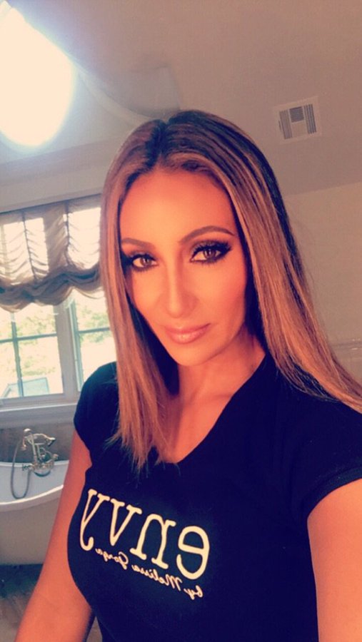 Melissa Gorga wears an Envy T-shirt.