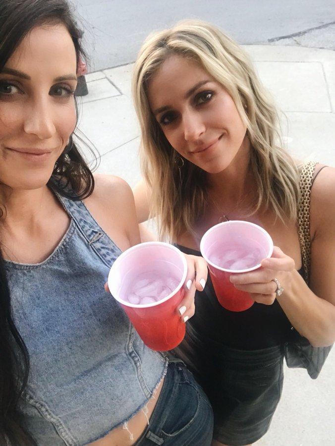 Kristin Cavallari and a friend drink from red Solo cups.