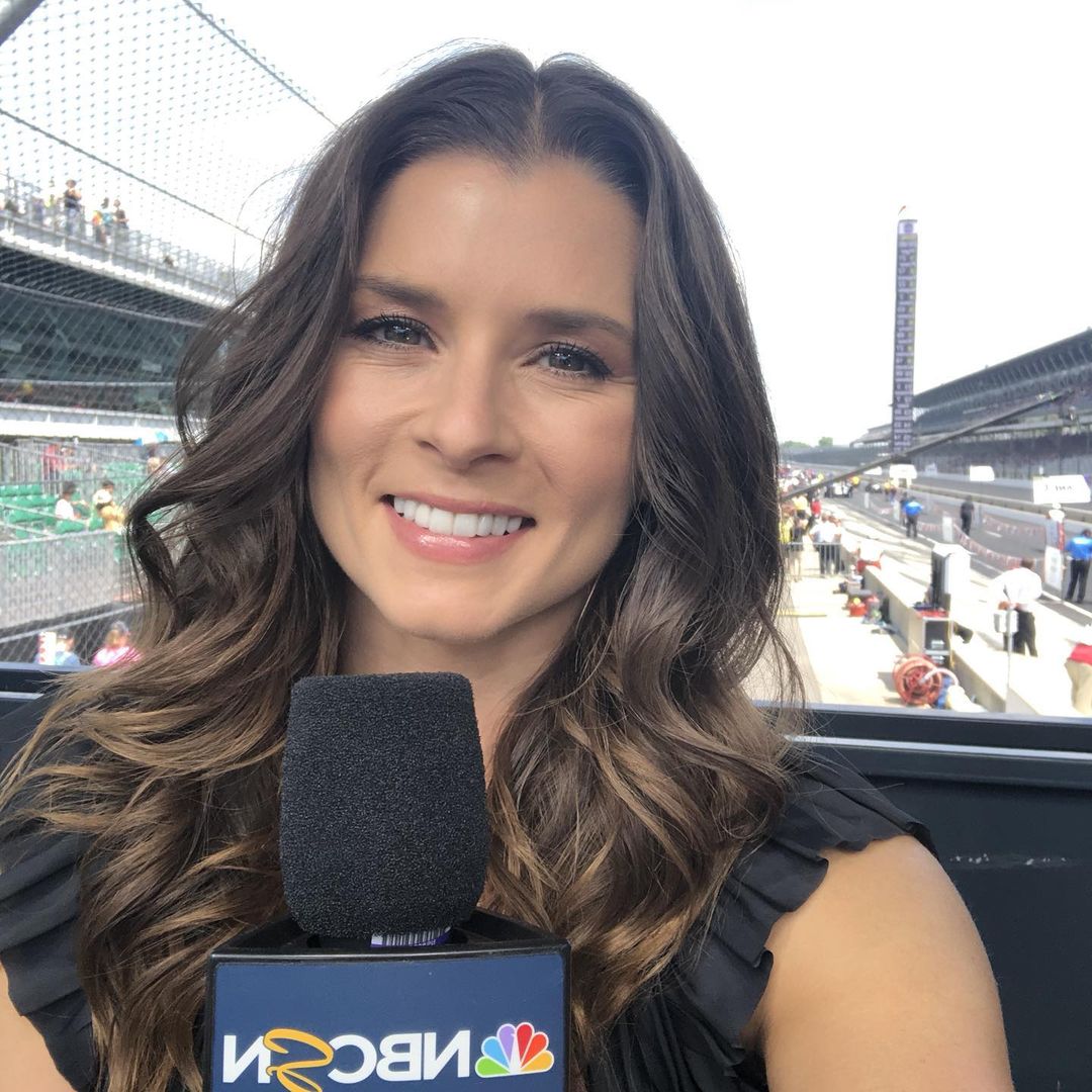 A photo showing Danica Patrick giving an exclusive to NBC at an event.