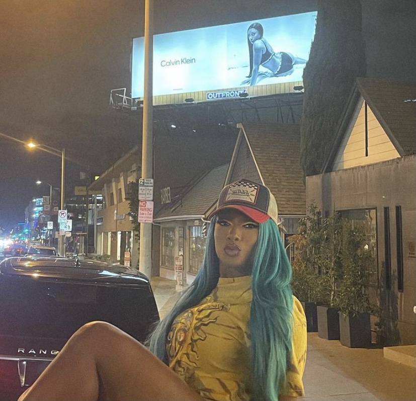 Megan in front of one of her Calvin Klein billboards.