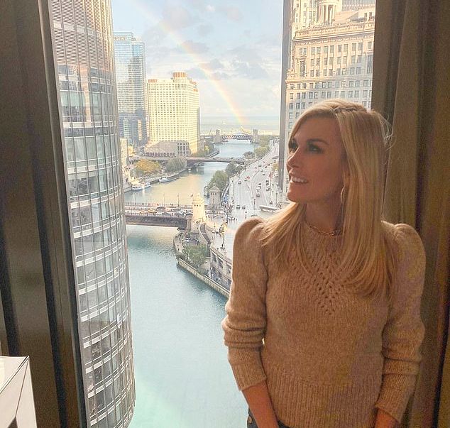 Tinsley Mortimer looks at a rainbow in a sweater.