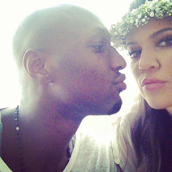 Lamar Odom and Khloe Kardashian taking a kissy face selfie