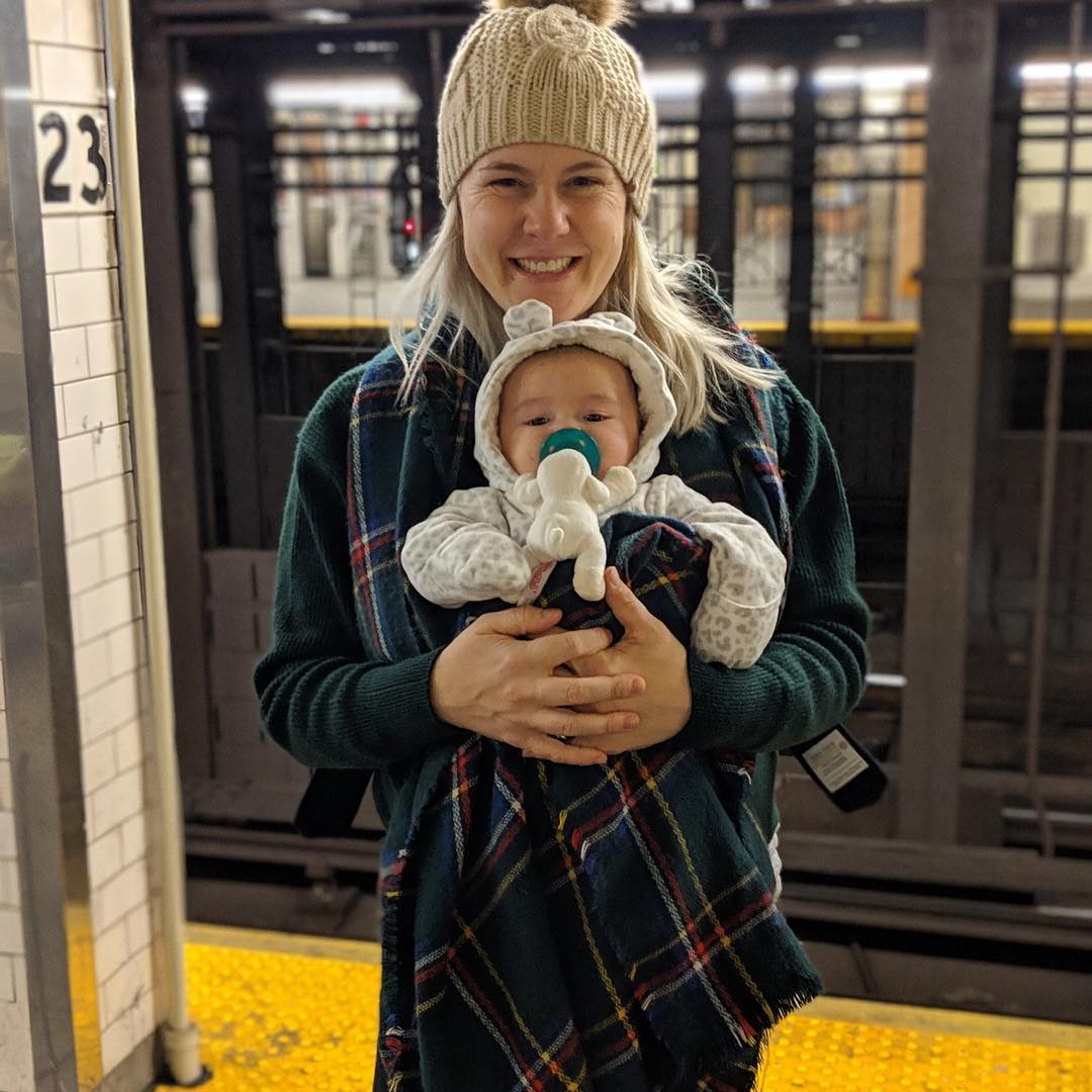 A photo showing Julie Plake McMinn and her bundle of joy, sharing a selfie.