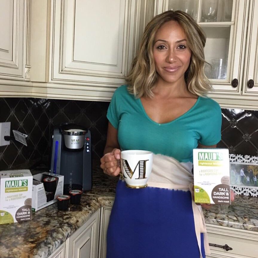 Melissa Gorga holds a 'M' mug.