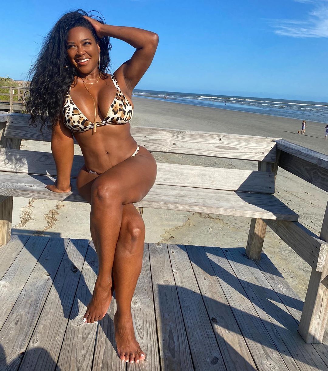 Kenya Moore wears a leopard-print bikini.