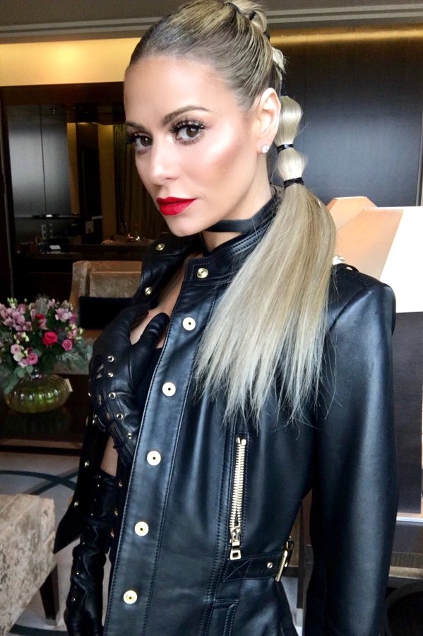 Dorit Kemsley wears a leather jacket and a ponytail.